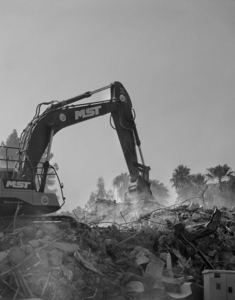 Excavator tearing up ground. Land excavation Cincinnati Ohio