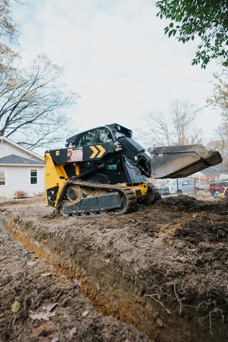 Excavator Digging Ground, Land Trenching In backyard of Cincinnati Ohio